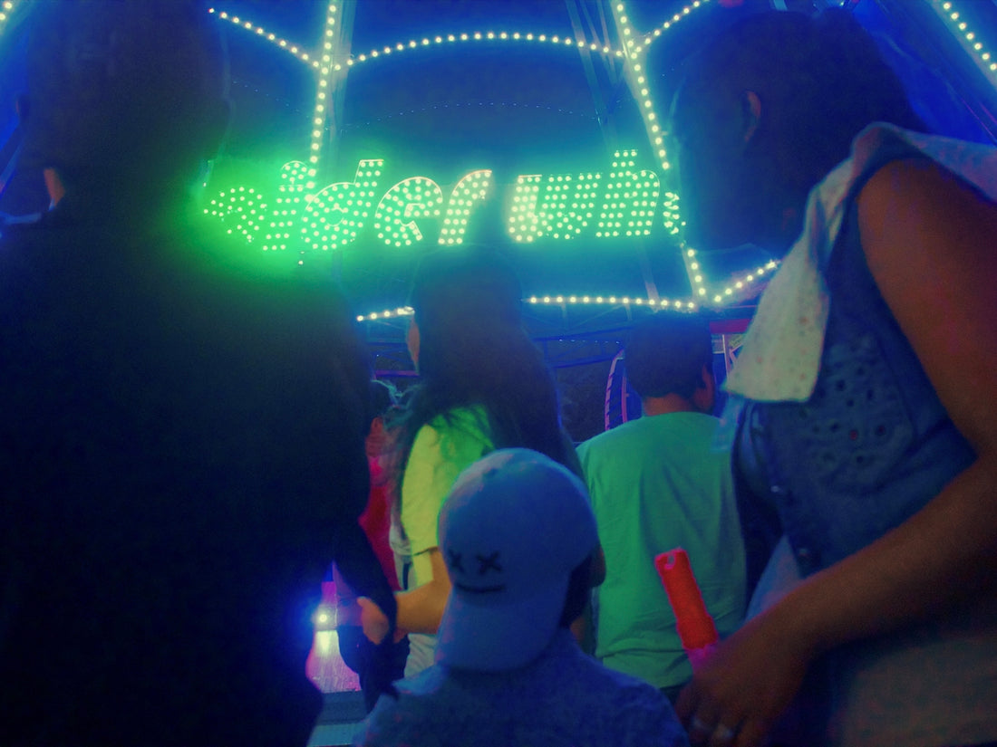 a group of people in a room with a bright light